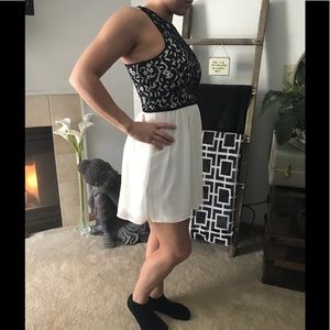 Beautiful black lace and white chiffon above knee.